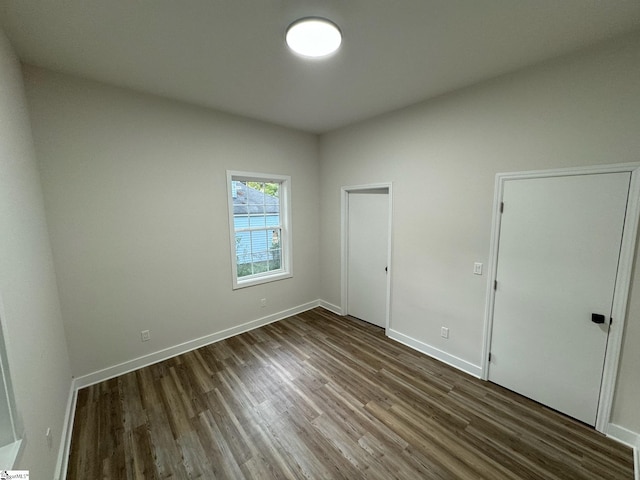 205 Magnolia St, Gaffney, SC 29340 - unfurnished bedroom featuring dark wood finished floors and baseboards