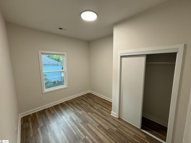 205 Magnolia St, Gaffney, SC 29340 - unfurnished bedroom featuring wood finished floors, a closet, and baseboards