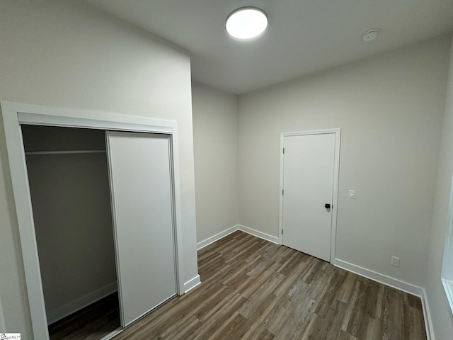 205 Magnolia St, Gaffney, SC 29340 - unfurnished bedroom featuring wood finished floors, a closet, and baseboards