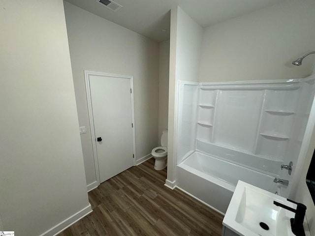 205 Magnolia St, Gaffney, SC 29340 - full bath featuring toilet, wood finished floors,  shower combination, baseboards, and vanity