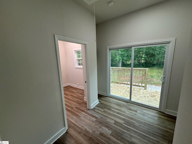 205 Magnolia St, Gaffney, SC 29340 - unfurnished room featuring wood finished floors, baseboards, attic access, and a smoke detector