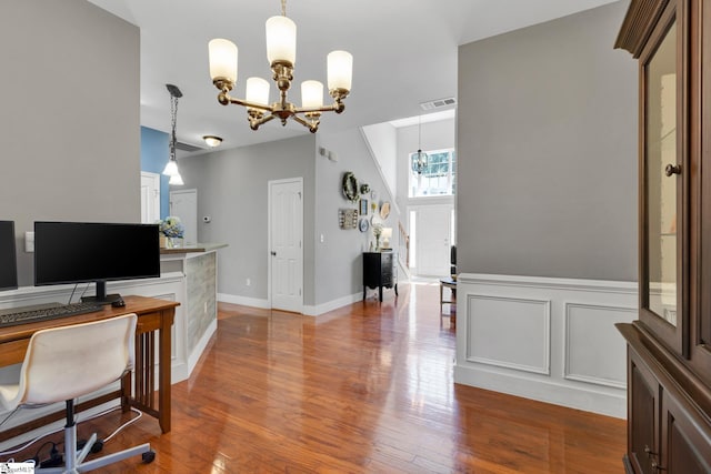 103 Circle Grove Ct, Greer, SC 29650 - home office featuring a chandelier, wood finished floors, and wainscoting