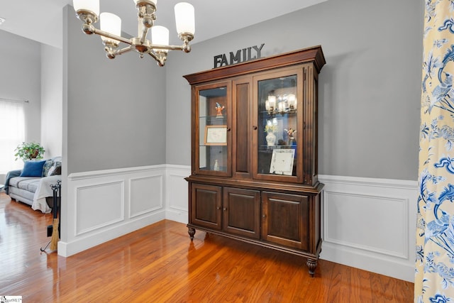 103 Circle Grove Ct, Greer, SC 29650 - dining space with a chandelier, wainscoting, wood finished floors, and a decorative wall