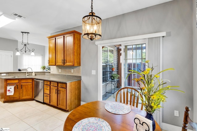 103 Circle Grove Ct, Greer, SC 29650 - kitchen with a sink, dishwasher, brown cabinetry, a chandelier, and light tile patterned floors