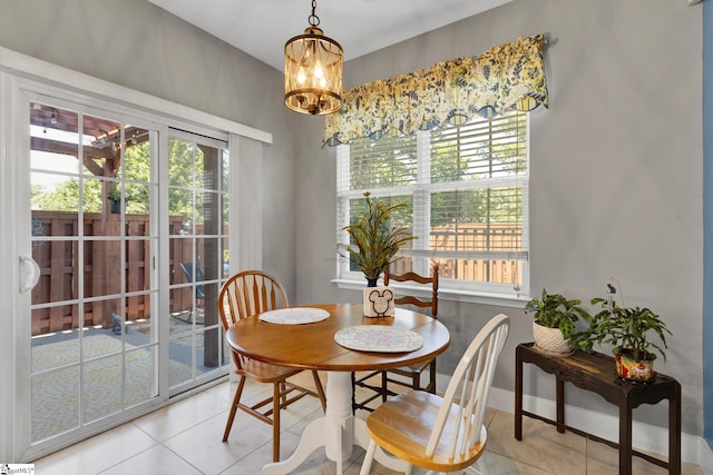 103 Circle Grove Ct, Greer, SC 29650 - dining area featuring light tile patterned floors, a chandelier, and healthy amount of natural light