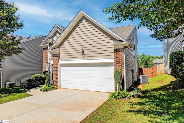 103 Circle Grove Ct, Greer, SC 29650 - view of front of property featuring brick siding, central air condition unit, a garage, and concrete driveway