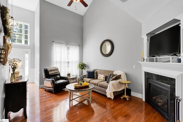 103 Circle Grove Ct, Greer, SC 29650 - living area featuring high vaulted ceiling, ceiling fan, a fireplace, wood-type flooring, and baseboards