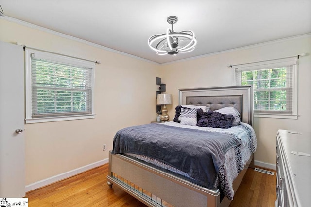 3 Creighton Ct, Taylors, SC 29687 - bedroom featuring a chandelier, light wood-style flooring, ornamental molding, and baseboards