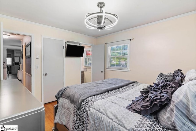 3 Creighton Ct, Taylors, SC 29687 - bedroom featuring a chandelier, ornamental molding, and light wood-type flooring