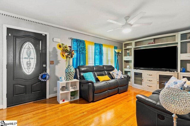 3 Creighton Ct, Taylors, SC 29687 - living area with ceiling fan, light wood-style floors, and crown molding
