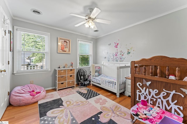 208 Forrester Creek Way, Greenville, SC 29607 - bedroom with wood finished floors, multiple windows, crown molding, a nursery area, and a ceiling fan