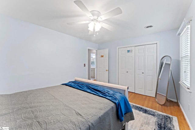 208 Forrester Creek Way, Greenville, SC 29607 - bedroom featuring multiple windows, light wood finished floors, a closet, and ceiling fan