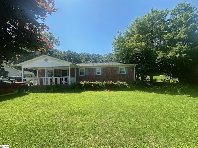 148 Southland Ave, Boiling Springs, SC 29316 - back of house featuring covered porch, a yard, and brick siding