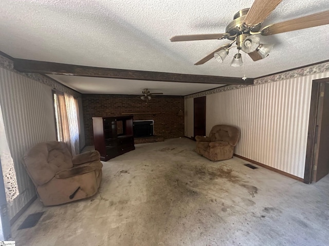148 Southland Ave, Boiling Springs, SC 29316 - unfurnished living room featuring ceiling fan, a brick fireplace, a textured ceiling, and beamed ceiling