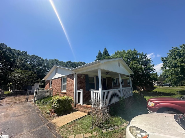 148 Southland Ave, Boiling Springs, SC 29316 - view of front of home with a porch, a gate, and brick siding