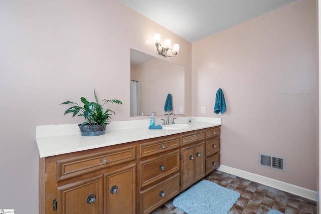 223 Covington Rd, Greenville, SC 29617 - bathroom featuring vanity, baseboards, and stone finish flooring