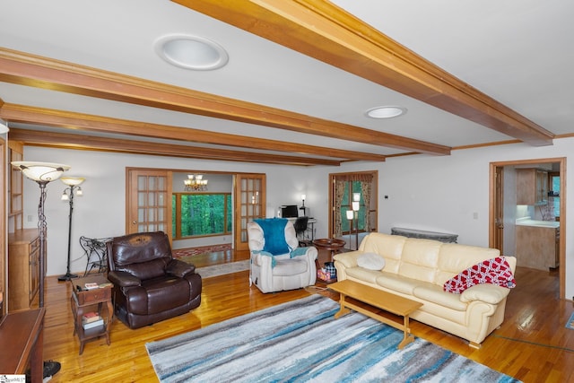 223 Covington Rd, Greenville, SC 29617 - living area featuring wood finished floors, beamed ceiling, and a chandelier