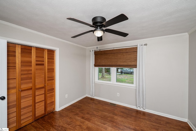 110 Sycamore Dr, Mauldin, SC 29662 - unfurnished bedroom featuring wood finished floors, a closet, baseboards, crown molding, and a textured ceiling