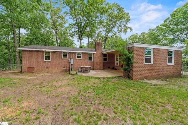 110 Sycamore Dr, Mauldin, SC 29662 - back of property with crawl space, a patio area, a chimney, and brick siding
