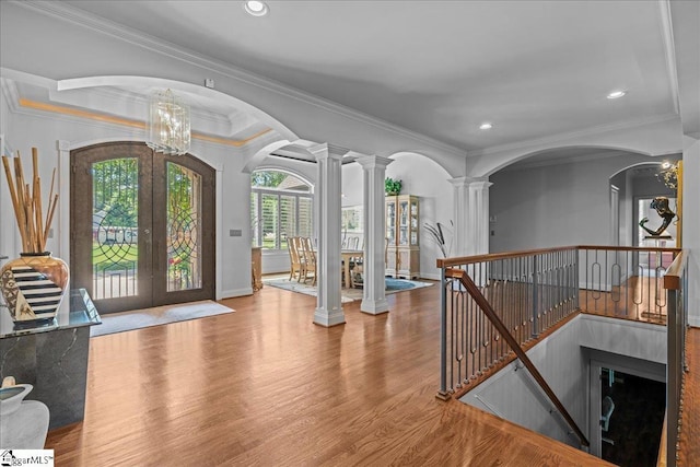 135 Neal Pointe Dr, Chesnee, SC 29323 - foyer with french doors, wood finished floors, ornamental molding, decorative columns, and arched walkways