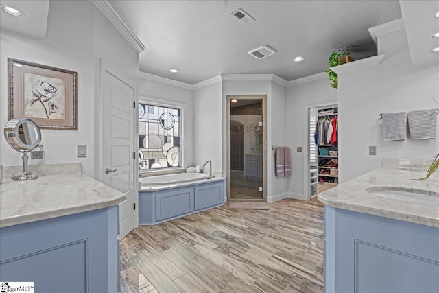 135 Neal Pointe Dr, Chesnee, SC 29323 - full bathroom featuring crown molding, a shower stall, two vanities, a bath, and recessed lighting