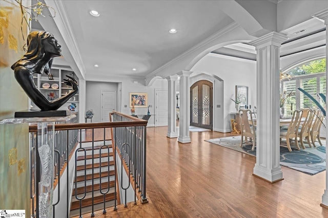 135 Neal Pointe Dr, Chesnee, SC 29323 - hallway with ornate columns, arched walkways, wood finished floors, ornamental molding, and baseboards