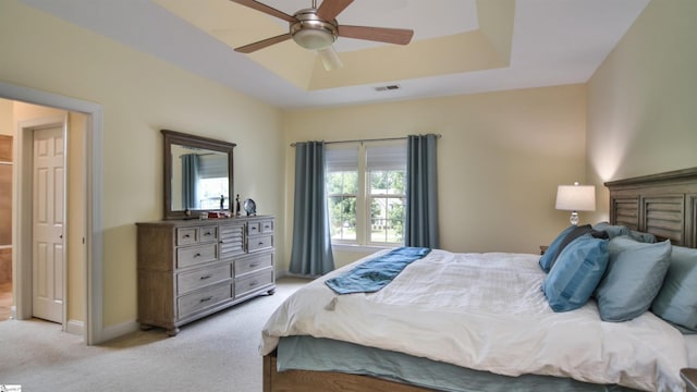 225 Highgrove Ct, Simpsonville, SC 29681 - bedroom featuring light colored carpet, a tray ceiling, ceiling fan, and baseboards