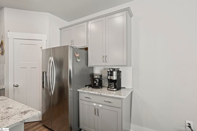 7 Grey Oak Trl, Greer, SC 29650 - kitchen featuring stainless steel refrigerator with ice dispenser, gray cabinetry, and light stone counters