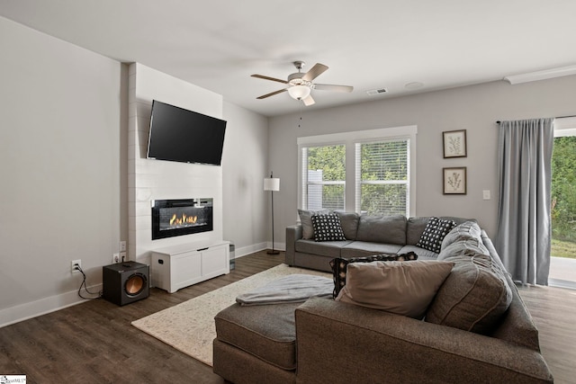 7 Grey Oak Trl, Greer, SC 29650 - living area featuring a ceiling fan, wood finished floors, baseboards, and a fireplace