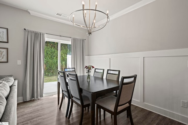 7 Grey Oak Trl, Greer, SC 29650 - dining area with a chandelier, dark wood-type flooring, ornamental molding, a decorative wall, and a wainscoted wall