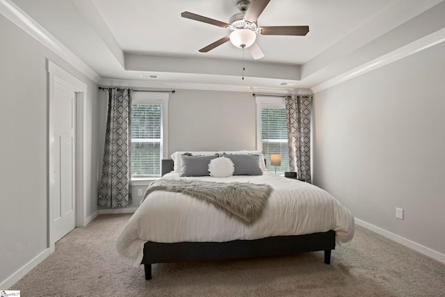 7 Grey Oak Trl, Greer, SC 29650 - carpeted bedroom with a tray ceiling, baseboards, and a ceiling fan