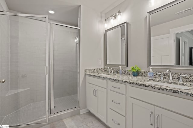 7 Grey Oak Trl, Greer, SC 29650 - bathroom with double vanity, a stall shower, recessed lighting, and tile patterned flooring