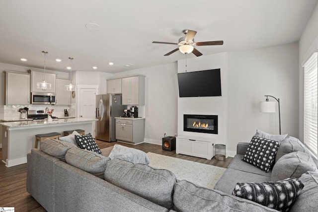 7 Grey Oak Trl, Greer, SC 29650 - living area with a ceiling fan, recessed lighting, dark wood-type flooring, baseboards, and a fireplace