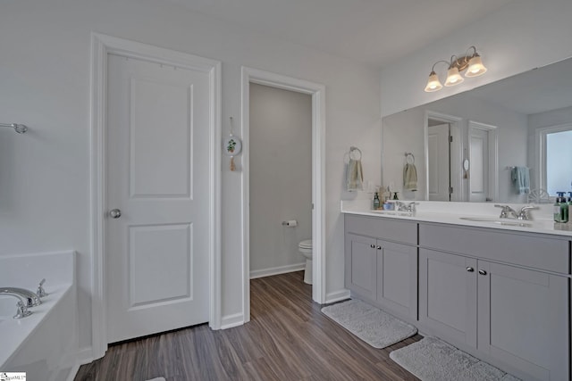 105 Ella B Ln, Easley, SC 29640 - full bath with wood finished floors, double vanity, toilet, a bath, and baseboards