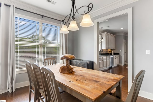 10 Croydon Way, Greenville, SC 29609 - dining space featuring baseboards, crown molding, and dark wood-type flooring
