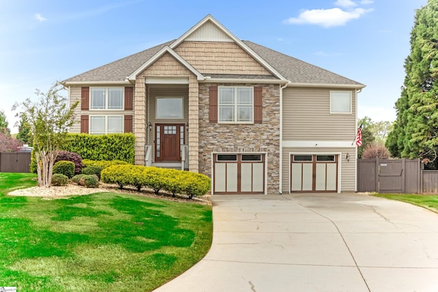 10 Croydon Way, Greenville, SC 29609 - view of front of home with stone siding, driveway, a garage, and a shingled roof