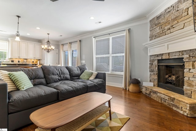 10 Croydon Way, Greenville, SC 29609 - living area featuring a chandelier, a fireplace, crown molding, dark wood-style flooring, and recessed lighting