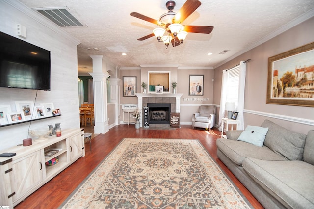 770 Grace Valley Rd, Inman, SC 29349 - living area featuring a textured ceiling, dark wood-type flooring, a ceiling fan, a tiled fireplace, and recessed lighting