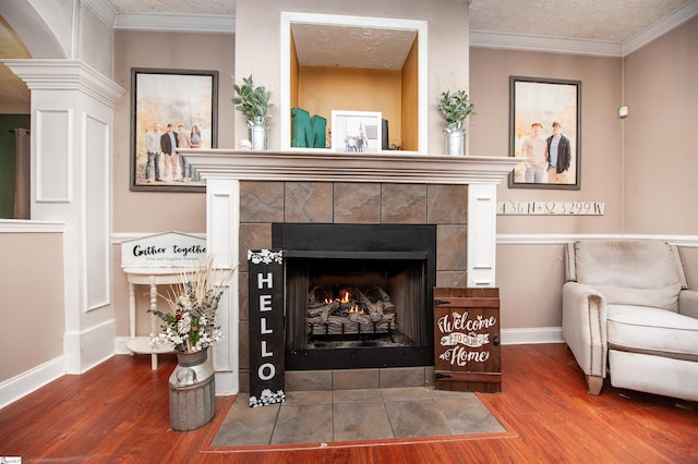 770 Grace Valley Rd, Inman, SC 29349 - detailed view of wood finished floors, a tiled fireplace, a textured ceiling, baseboards, and crown molding