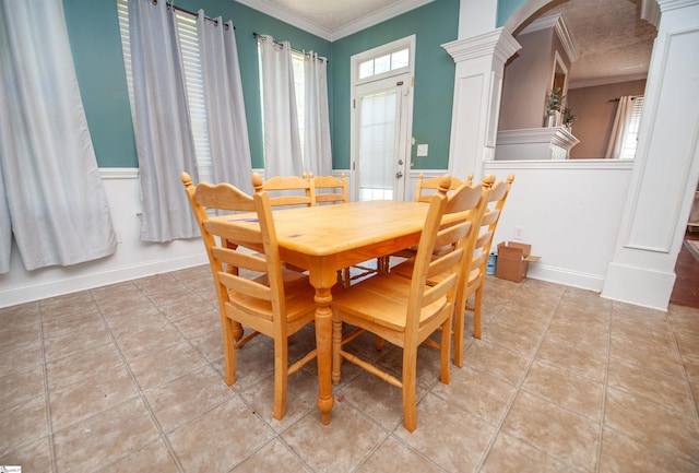 770 Grace Valley Rd, Inman, SC 29349 - dining area featuring ornamental molding, ornate columns, plenty of natural light, arched walkways, and wainscoting