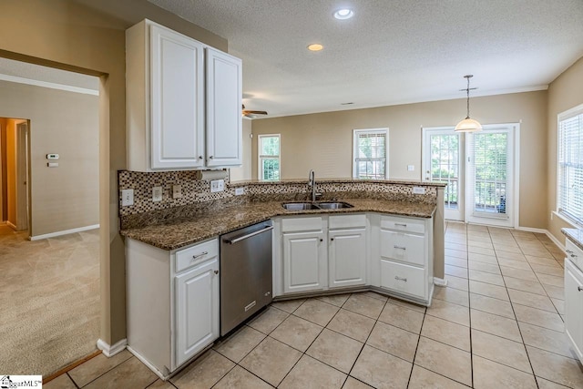 122 N Orchard Farms Ave, Simpsonville, SC 29681 - kitchen featuring a sink, stainless steel dishwasher, a peninsula, white cabinets, and baseboards