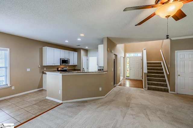 122 N Orchard Farms Ave, Simpsonville, SC 29681 - kitchen with appliances with stainless steel finishes, white cabinets, a textured ceiling, a sink, and recessed lighting