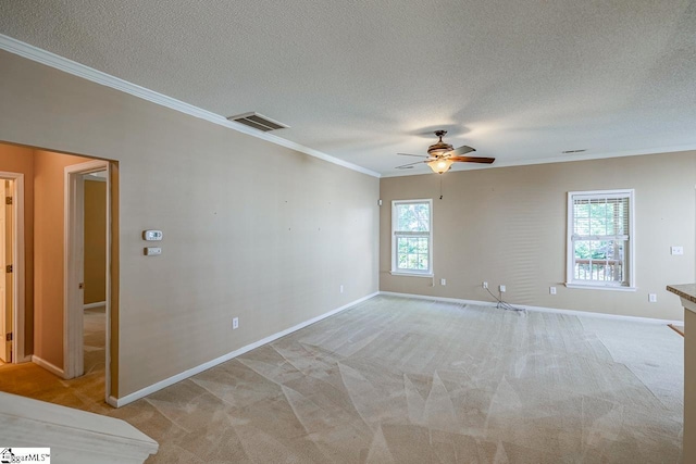 122 N Orchard Farms Ave, Simpsonville, SC 29681 - spare room featuring ornamental molding, ceiling fan, baseboards, a textured ceiling, and light colored carpet