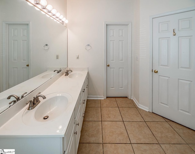 122 N Orchard Farms Ave, Simpsonville, SC 29681 - bathroom featuring double vanity, tile patterned flooring, and baseboards