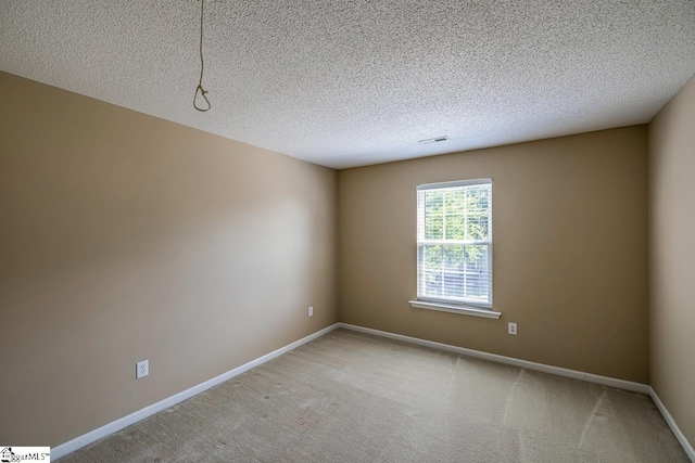 122 N Orchard Farms Ave, Simpsonville, SC 29681 - empty room featuring baseboards, a textured ceiling, and light colored carpet