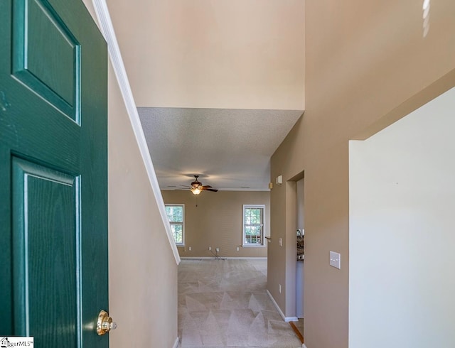 122 N Orchard Farms Ave, Simpsonville, SC 29681 - foyer with light colored carpet, ceiling fan, baseboards, and a textured ceiling