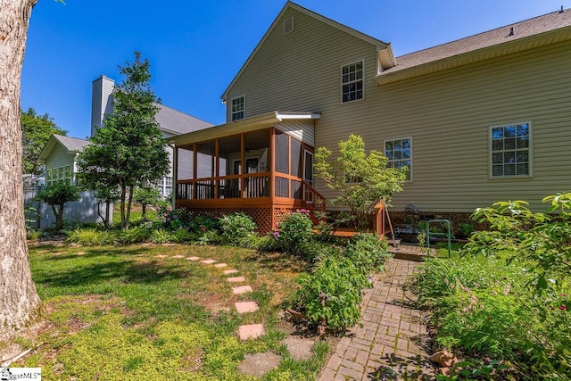 122 N Orchard Farms Ave, Simpsonville, SC 29681 - rear view of property with a sunroom and a yard