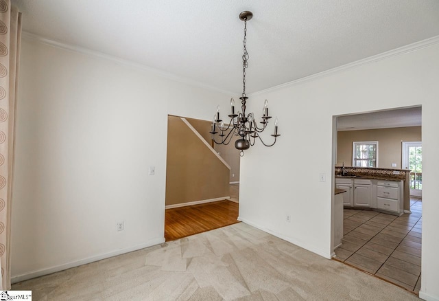 122 N Orchard Farms Ave, Simpsonville, SC 29681 - unfurnished dining area featuring a chandelier, crown molding, light colored carpet, baseboards, and a sink