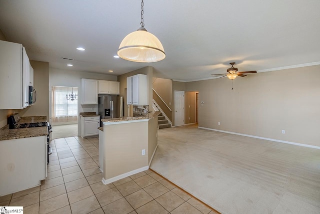 122 N Orchard Farms Ave, Simpsonville, SC 29681 - kitchen featuring stainless steel appliances, a ceiling fan, white cabinetry, a peninsula, and baseboards