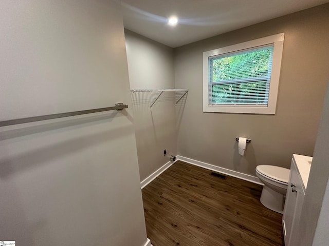 121 Pacolet Hwy, Gaffney, SC 29340 - bathroom featuring toilet, vanity, wood finished floors, baseboards, and a spacious closet